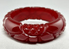BB434 translucent cranberry flower carved bakelite bangle